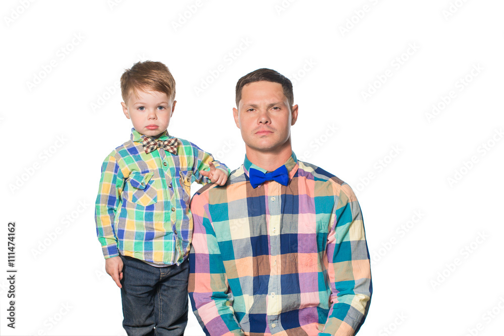 Father and son posing isolated on white in studio Father and son posing isolated on white in studio