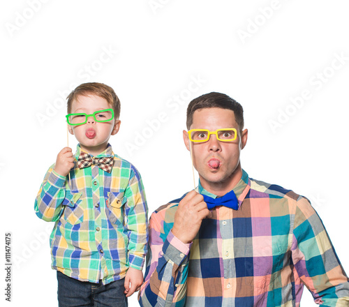 Father and son posing isolated on white in studio
