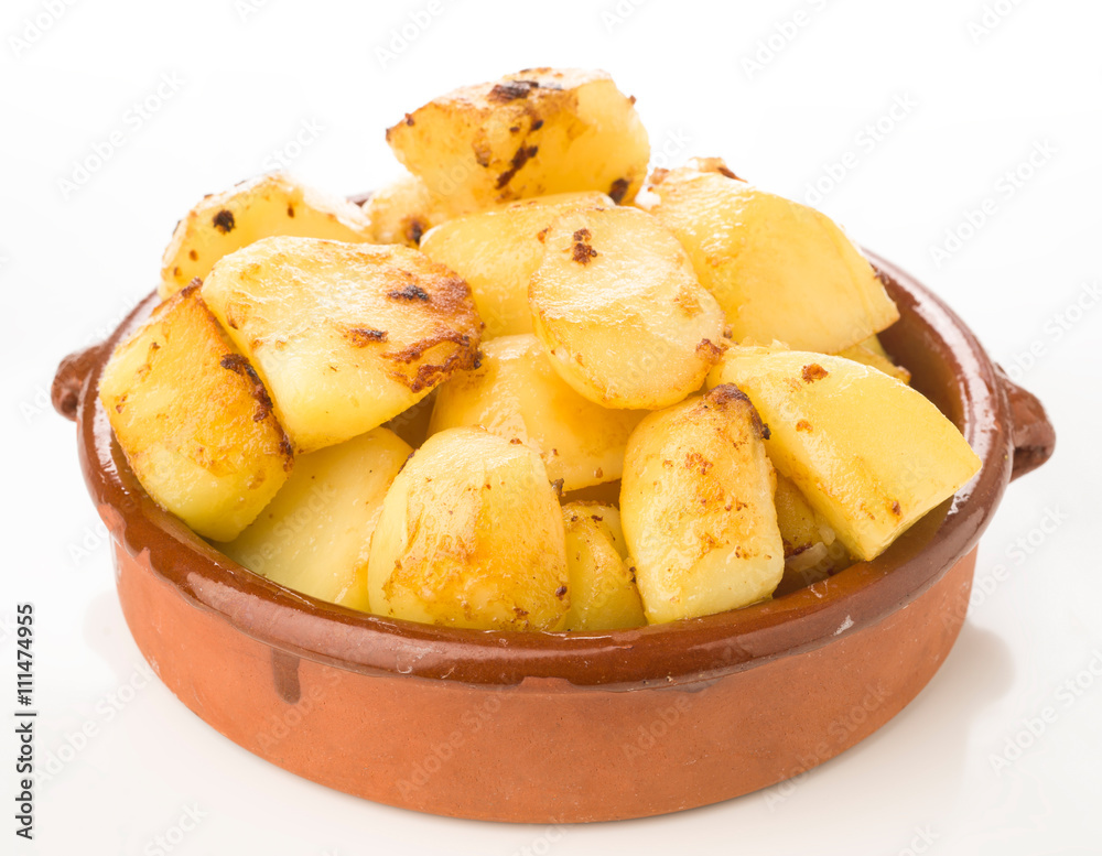 earthenware pie plate with cut chips, on white earthenware pie plate with cut chips, on white