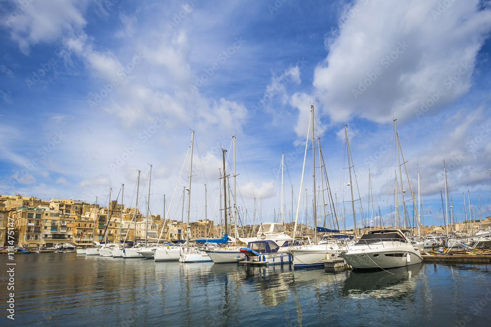 Malta - Yacht marina at Birgu with blue sky and clouds