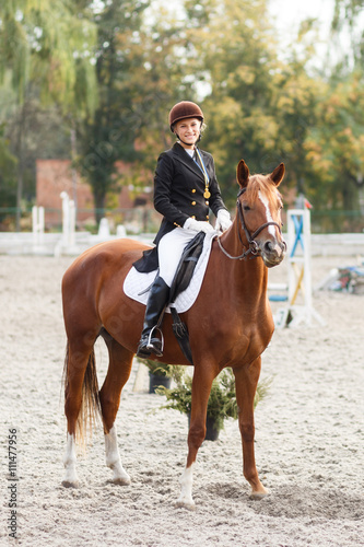 Teenage girl winning in equestrian competition © skumer