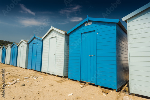 Blue beach huts in row