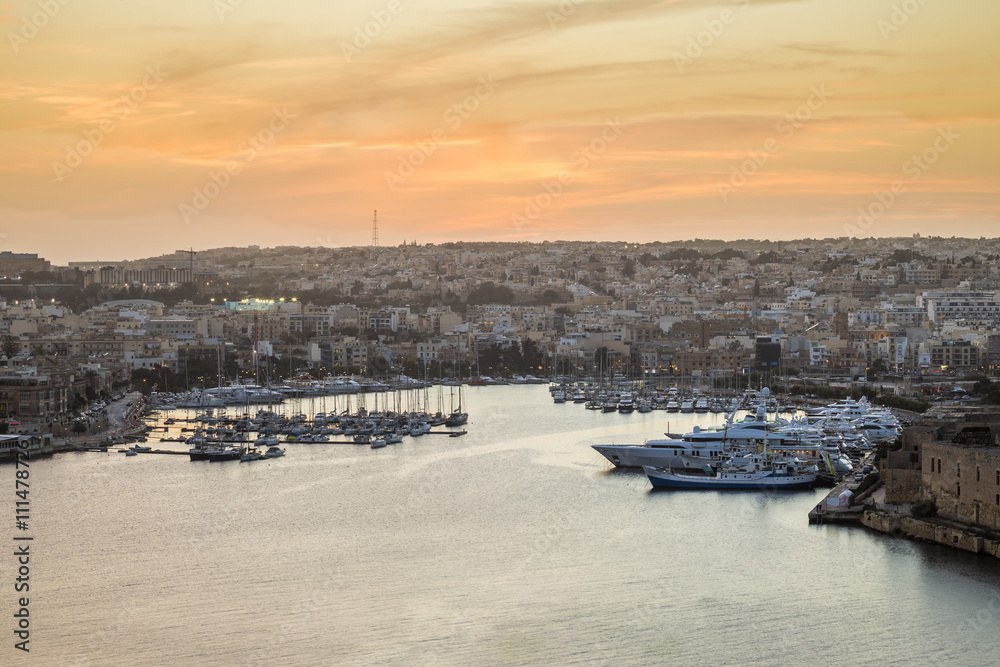 Malta panoramic skyline from Valletta at sunset