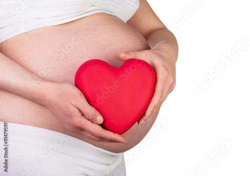 Wallpaper Mural Pregnant woman with red heart in hands isolated on white. Torontodigital.ca
