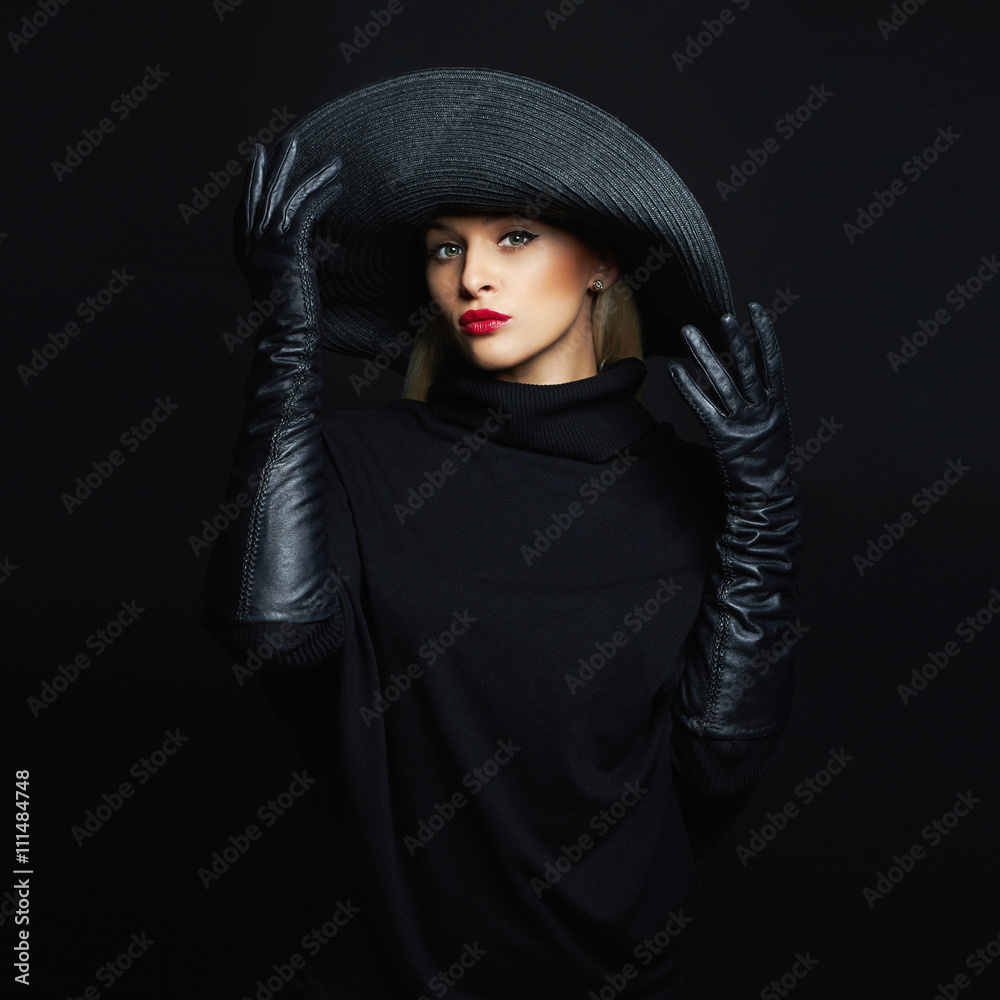 Beautiful woman in hat and leather gloves. halloween witch Beautiful woman in hat and leather gloves. halloween witch
