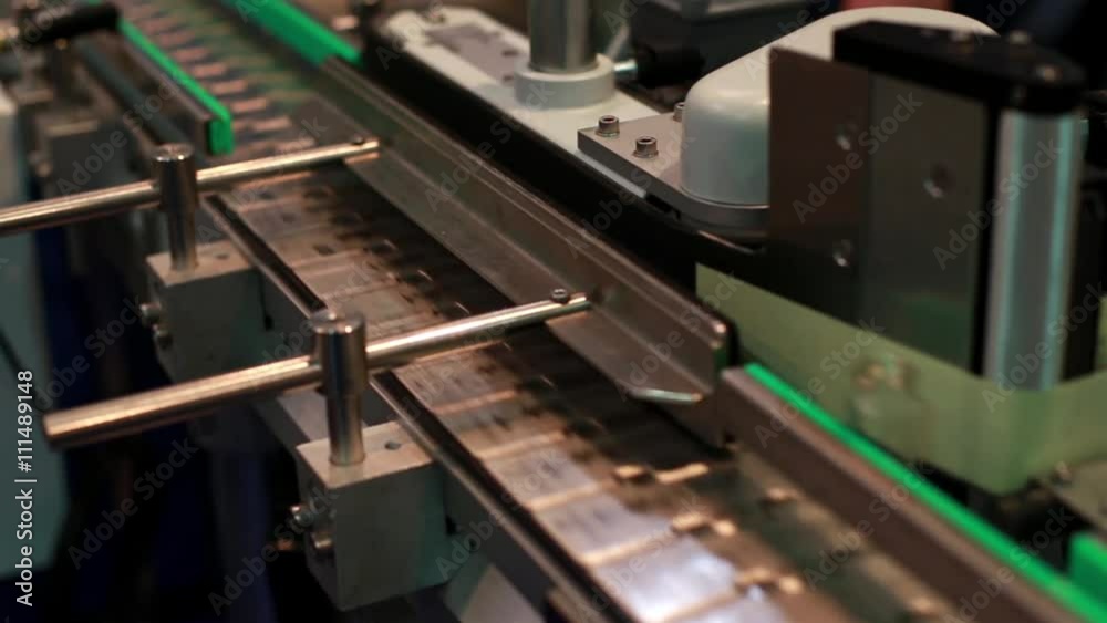 Medical test tubes on a conveyor belt Medical test tubes on a conveyor belt