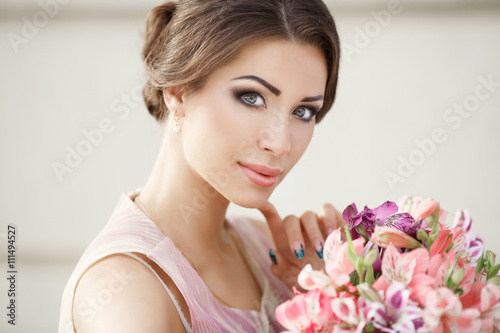 Beautiful woman with flowers outdoor