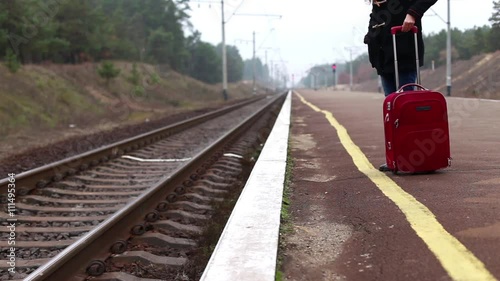 Girl at the Train Station Walking Along the Platform