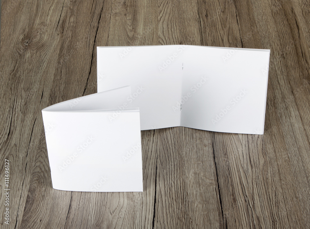 Blank catalog, brochure, magazines, book on wooden background Blank catalog, brochure, magazines, book on wooden background