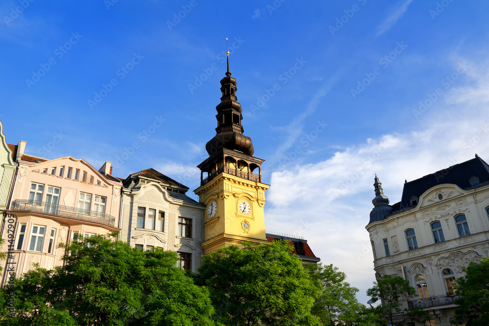 Old town hall (Stara radnice), Masaryk square (Masarykovo namesti), Ostrava, Czech republic / Czechia - facade of beautiful building with baroque spire. Sunny summer sunset.