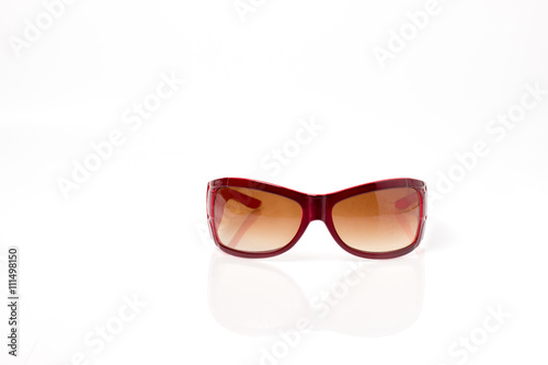 red plastic sun glasses with brown lens