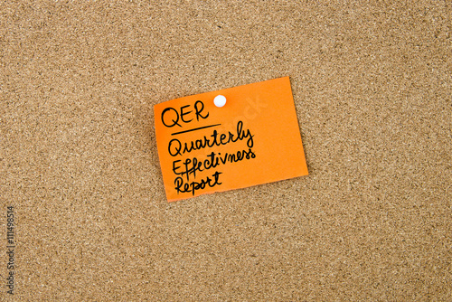 QUR as QUARTERLY EFFECTIVNESS REPORT written on orange paper note photo