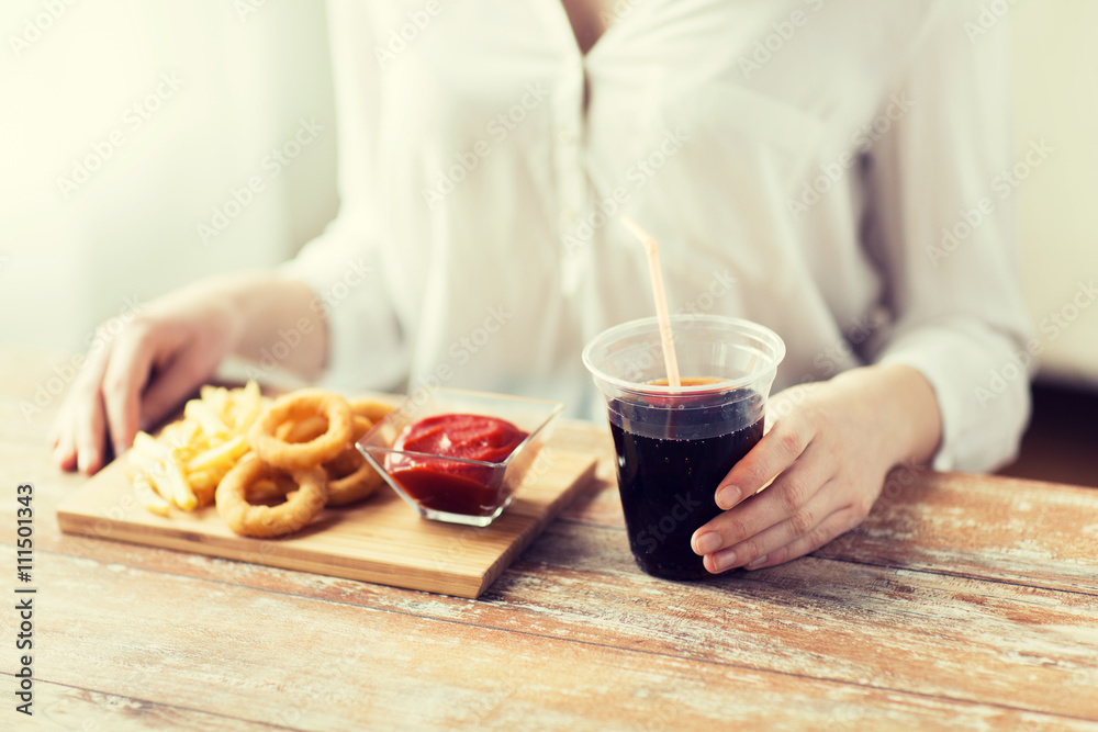 close up of woman with snacks and cola close up of woman with snacks and cola