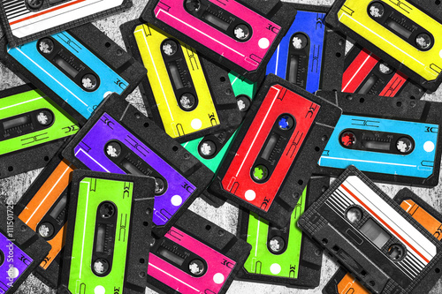 Old audio cassette. Multicolored audio tapes. Close-up view. The concept of old music. The era of retro songs. Isolated objects. large collection of retro cassette tapes. The music of yesteryear.