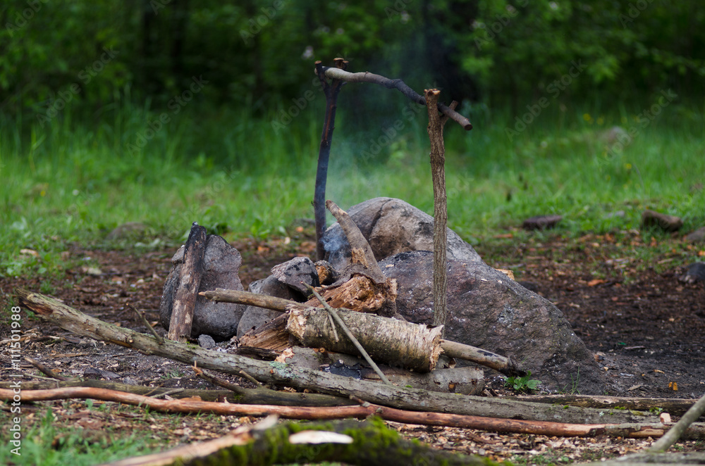 camping fire place. tourism adventure travel concept. cooking on open fire in the forest. camping fire place. tourism adventure travel concept. cooking on open fire in the forest.