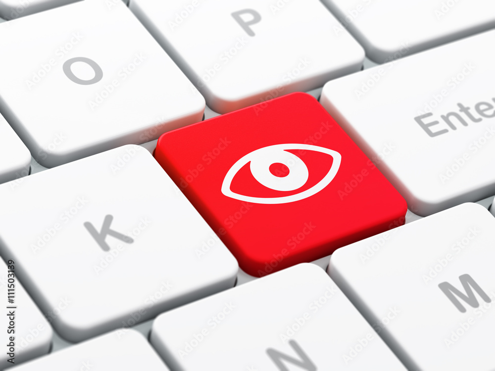 Security concept: Eye on computer keyboard background Security concept: Eye on computer keyboard background