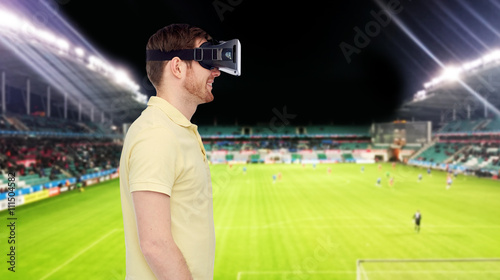man in virtual reality headset over football field