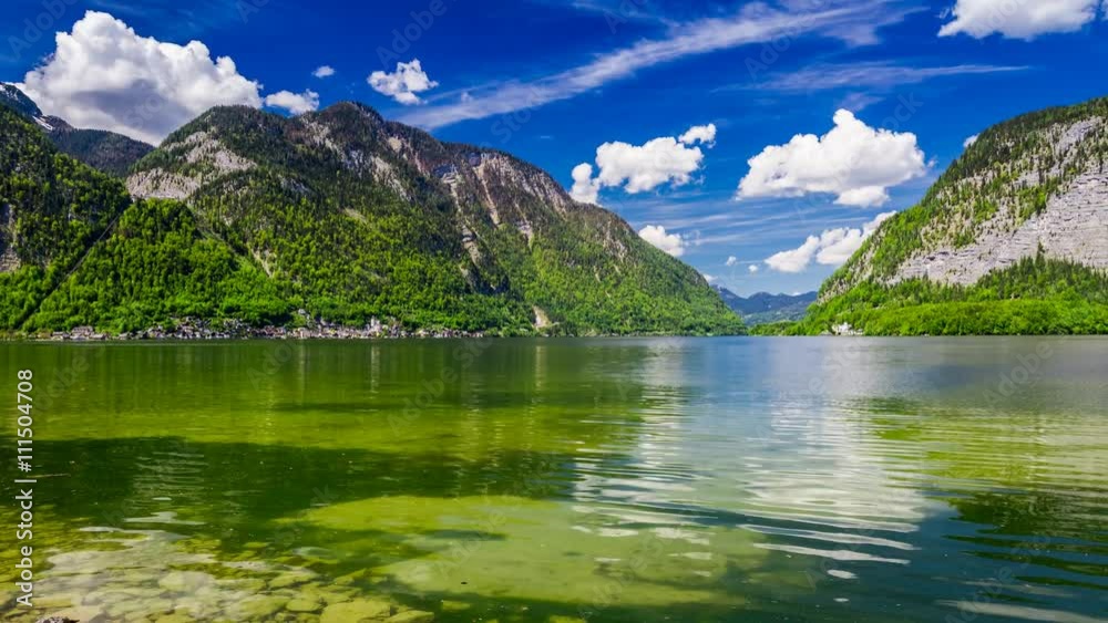 Mountain Lake in Hallstatt and clouds on a sunny day, 4k timelapse Mountain Lake in Hallstatt and clouds on a sunny day, 4k timelapse