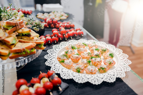 Tasty food on table at the reception banquet photo