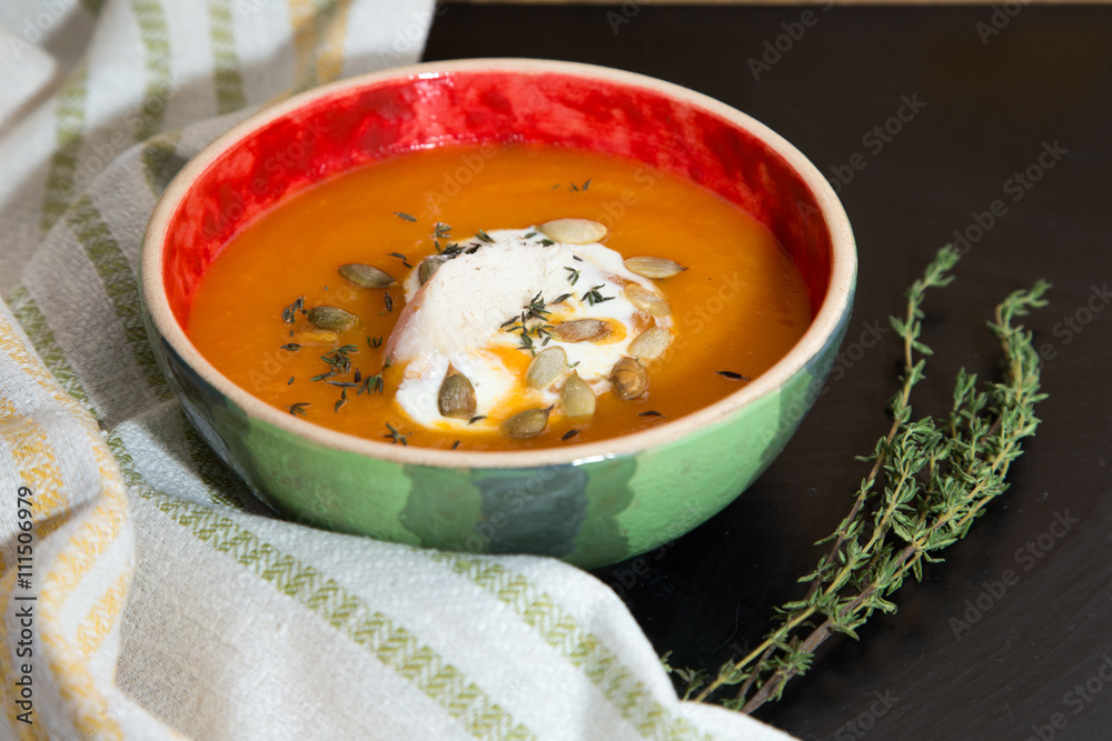 Pumpkin cream soup with chicken fillet, thyme and pumpkin seeds. Pumpkin cream soup with chicken fillet, thyme and pumpkin seeds.