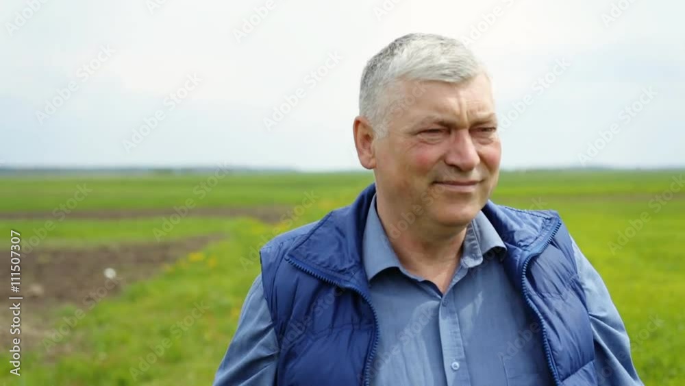 Old farmer walking on the garden. Old farmer walking on the garden.