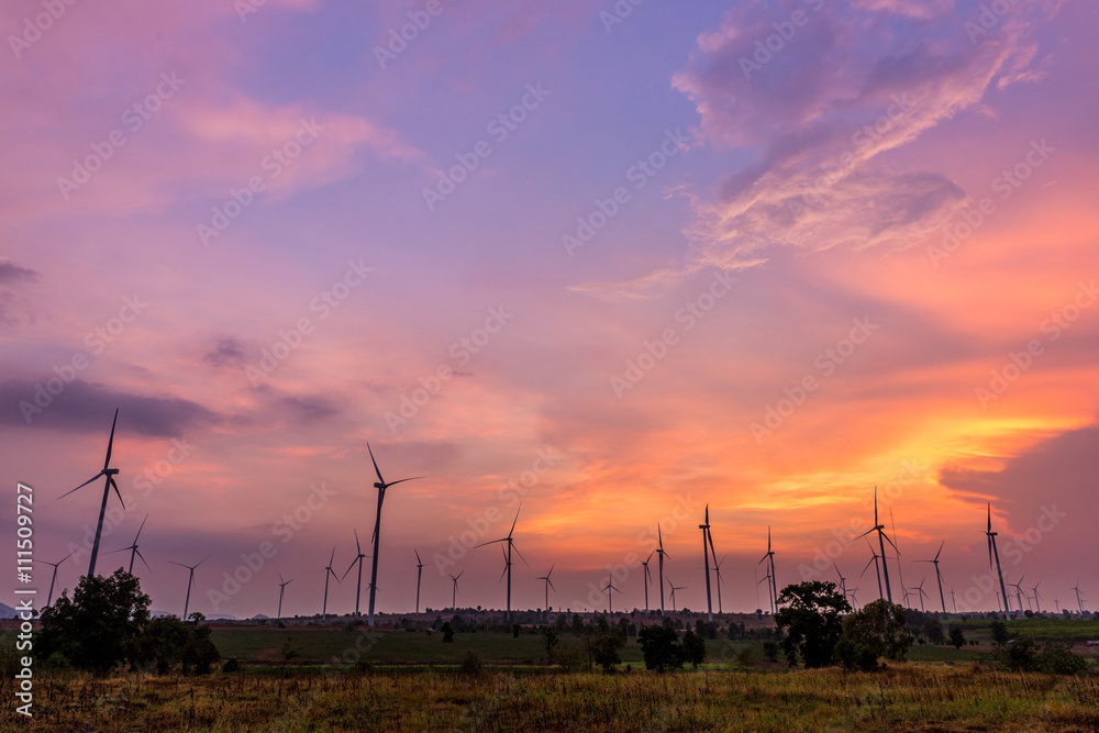 Obraz premium Wind turbine power generator at twilight