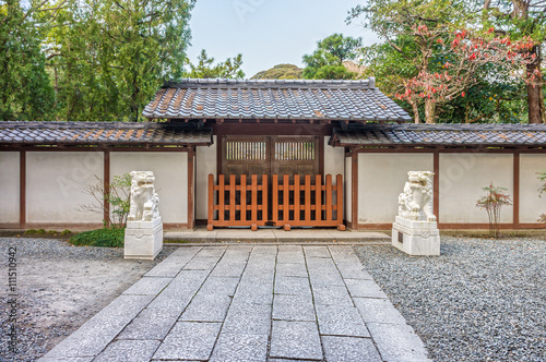 The entrance gate with lion sculptures of the Kotoku-in Temple. The temple is located in Kamakura, Kanagawa Prefecture, Japan.