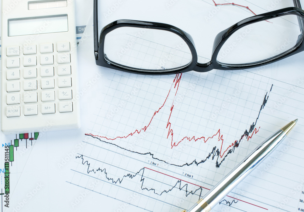 Paper graph with pen ,calculator and eyeglasses stock market analysis
Paper graph with pen ,calculator and eyeglasses stock market analysis