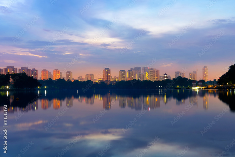 Reflection of building in the lake at sunrise at lakeside. Singa