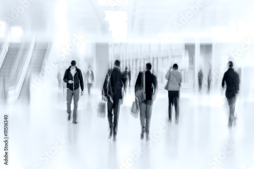 group of people in the lobby business center and blue tonality