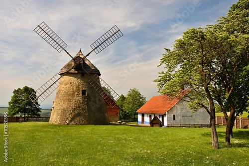 Old windmill - Czech Republic Europe. Beautiful old traditional mill house with a garden. Kuzelov - South Moravia.