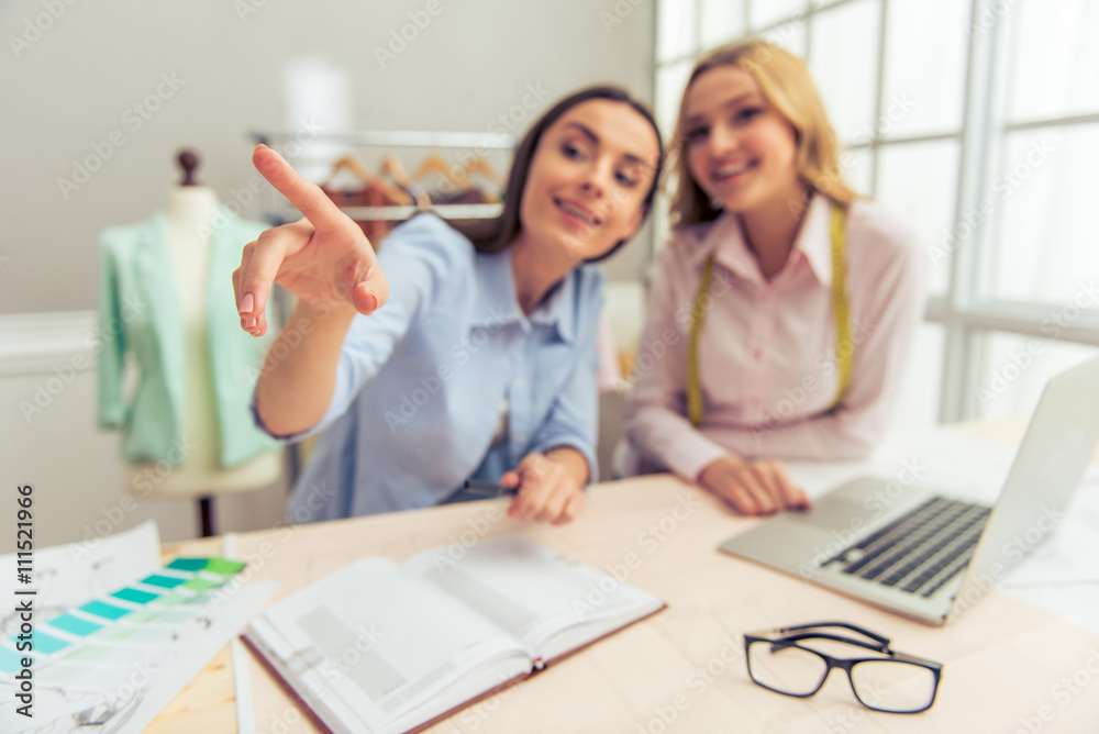 Obraz premium Beautiful designers working with gadget