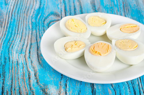 Boiled hen eggs in a white plate