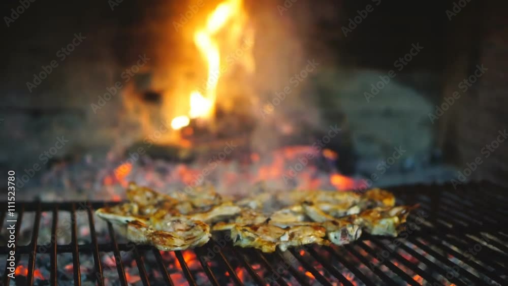 Sliding camera up to lamb chops on grill Sliding camera up to lamb chops on grill