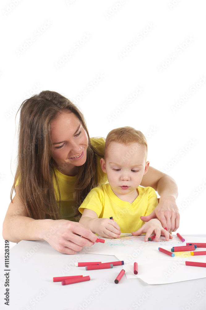 Mother and son are drawing the picture together Mother and son are drawing the picture together