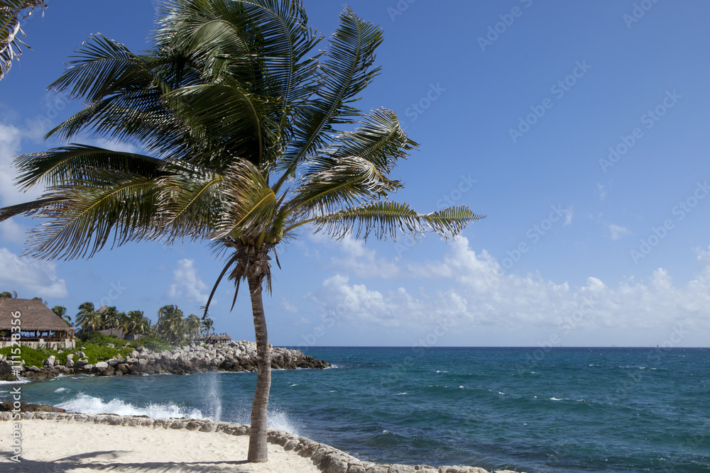 A beautiful vacation day along the Caribbean coastline of the Yucatán Peninsula in the area known as the Riviera Maya, just south of Playa del Carmen, Mexico. 