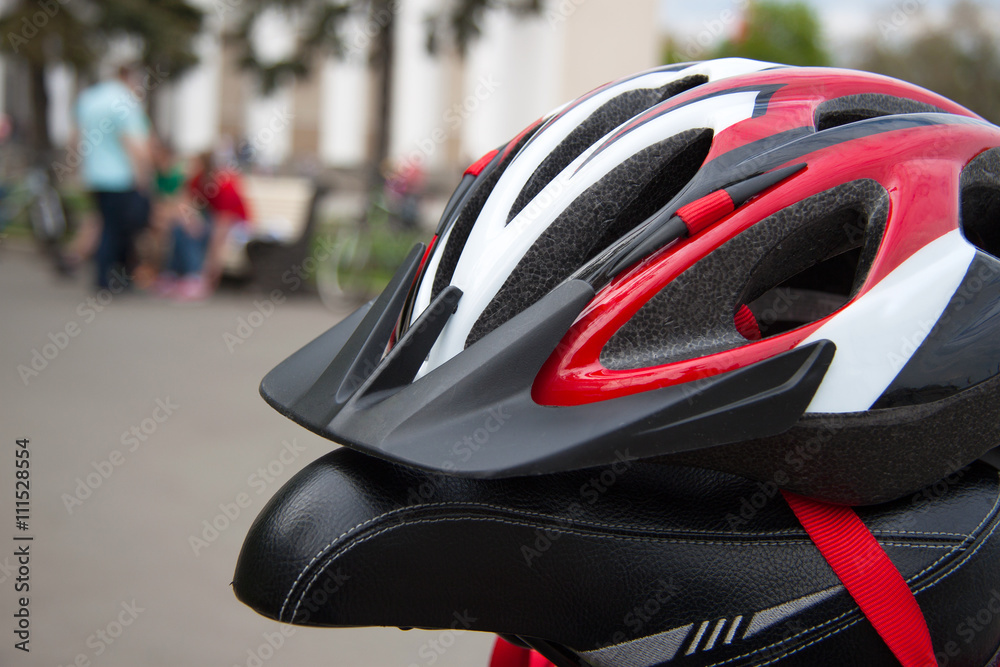 Cycling helmet on a bicycle seat Cycling helmet on a bicycle seat
