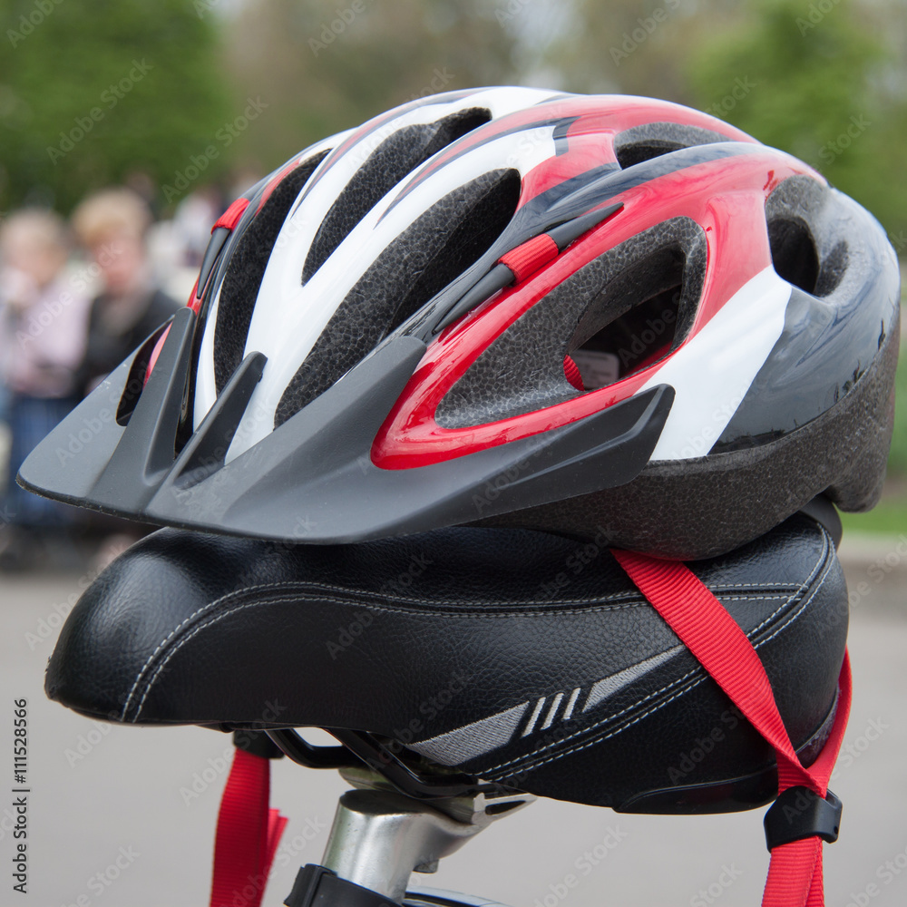 Cycling helmet on a bicycle seat