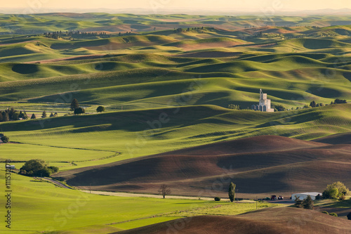 Washington Palouse. A spectacular sunset view from Steptoe Butte State Park of the surrounding farmland and small towns. From the top of the butte, the eye can see 200 miles. © LoweStock