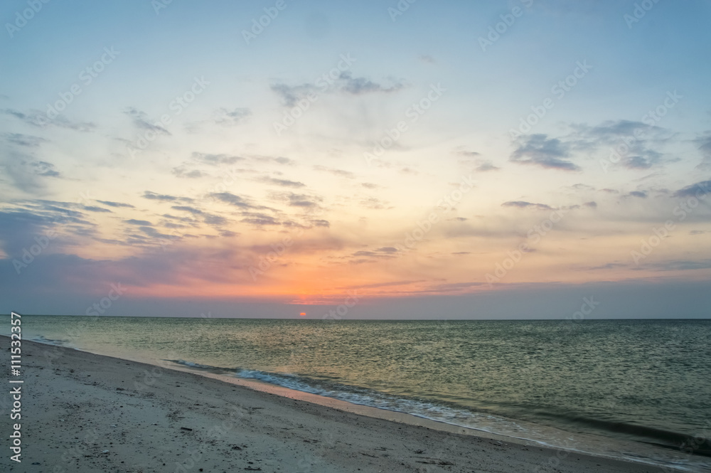 Beautiful sunny dawn on the sea