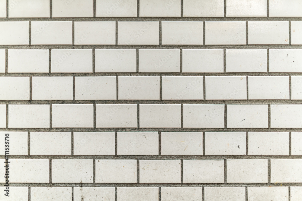 Naklejka premium dirty and grainy white grey tile city wall with splashes of dirt and colors from city life urban style background