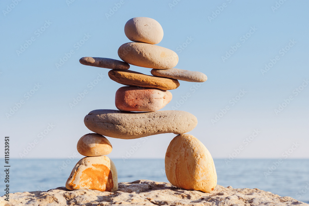 Inukshuk on sea background