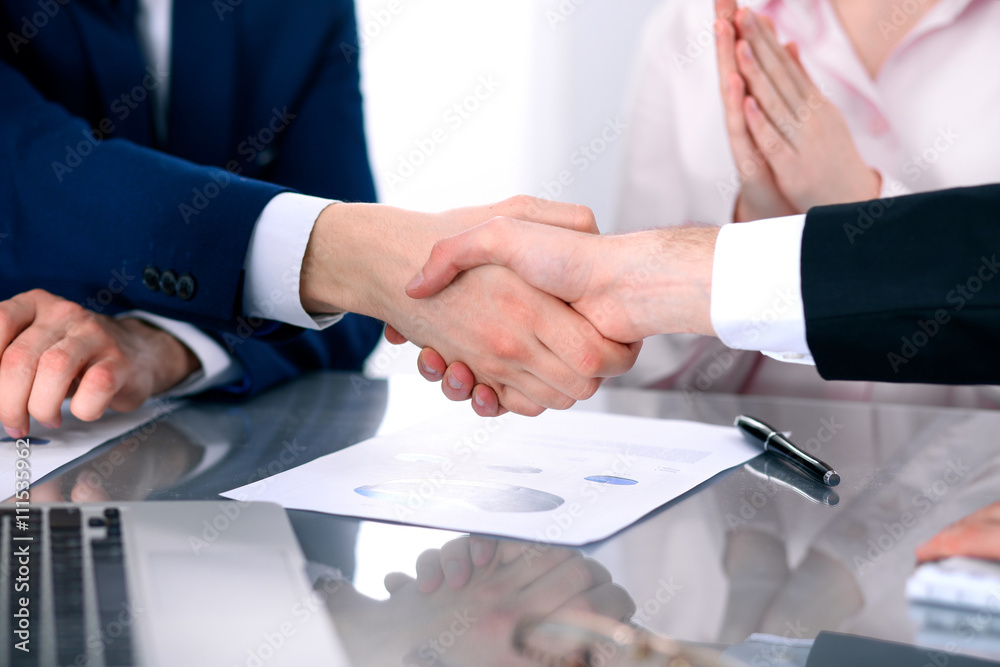 Business people shaking hands finishing up a meeting