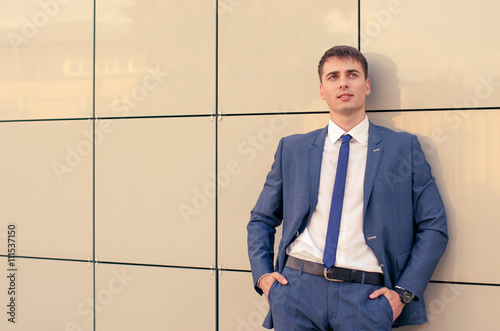 Office portrait of smiling young businessman