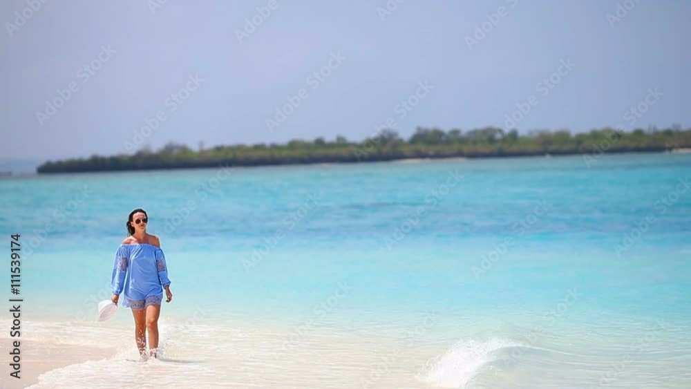 Young beautiful woman enjoying beach tropical vacation Young beautiful woman enjoying beach tropical vacation