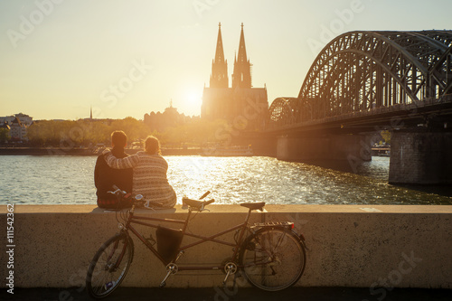 Fototapeta Young romantic couple spending their vacation in Cologne, German