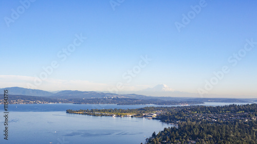 Aerial Shot of Forests  Lake  and Suburban Neighborhoods of Shoreline  Sand Point  North Seattle  Magnuson Park  Lake Washington  and Mt Rainier