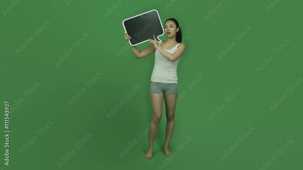 Asian sporty girl young adult isolated greenscreen green background upset blank speech Asian sporty girl young adult isolated greenscreen green background upset blank speech