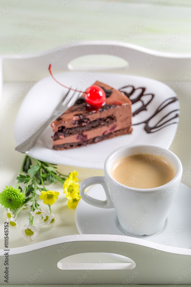 Cup of coffee and chocolate cake with cherries Cup of coffee and chocolate cake with cherries