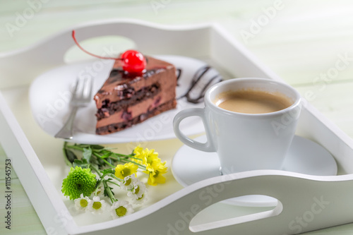 Coffee and chocolate cake with cherries
